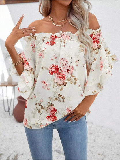 Blusa floreale con spalle scoperte