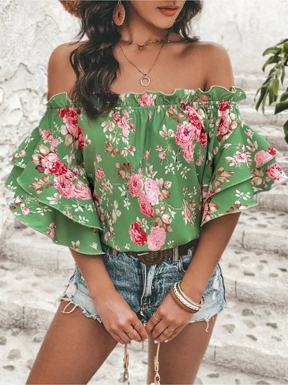Blusa floreale con spalle scoperte