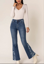 Jeans flare bootcut elasticizzati con stampa floreale