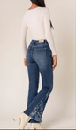 Jeans flare bootcut elasticizzati con stampa floreale